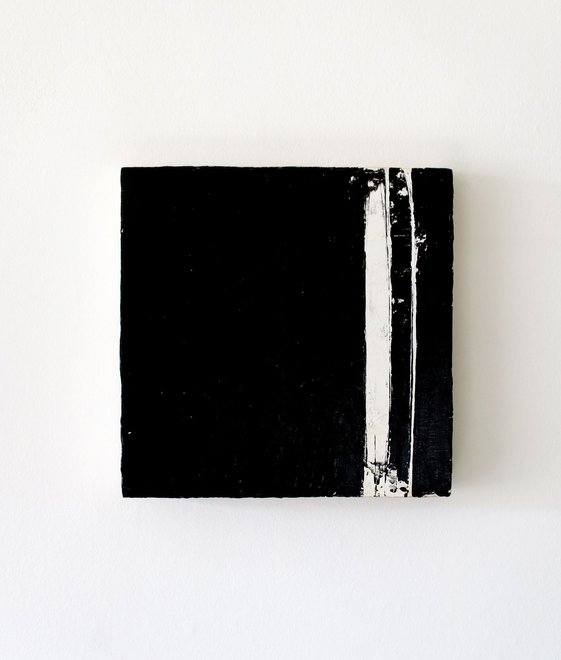 A black and white painting on a white wall