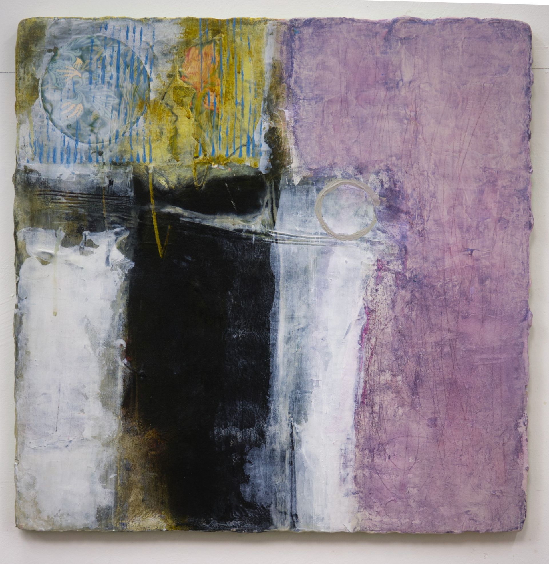 A purple and black painting is hanging on a white wall.