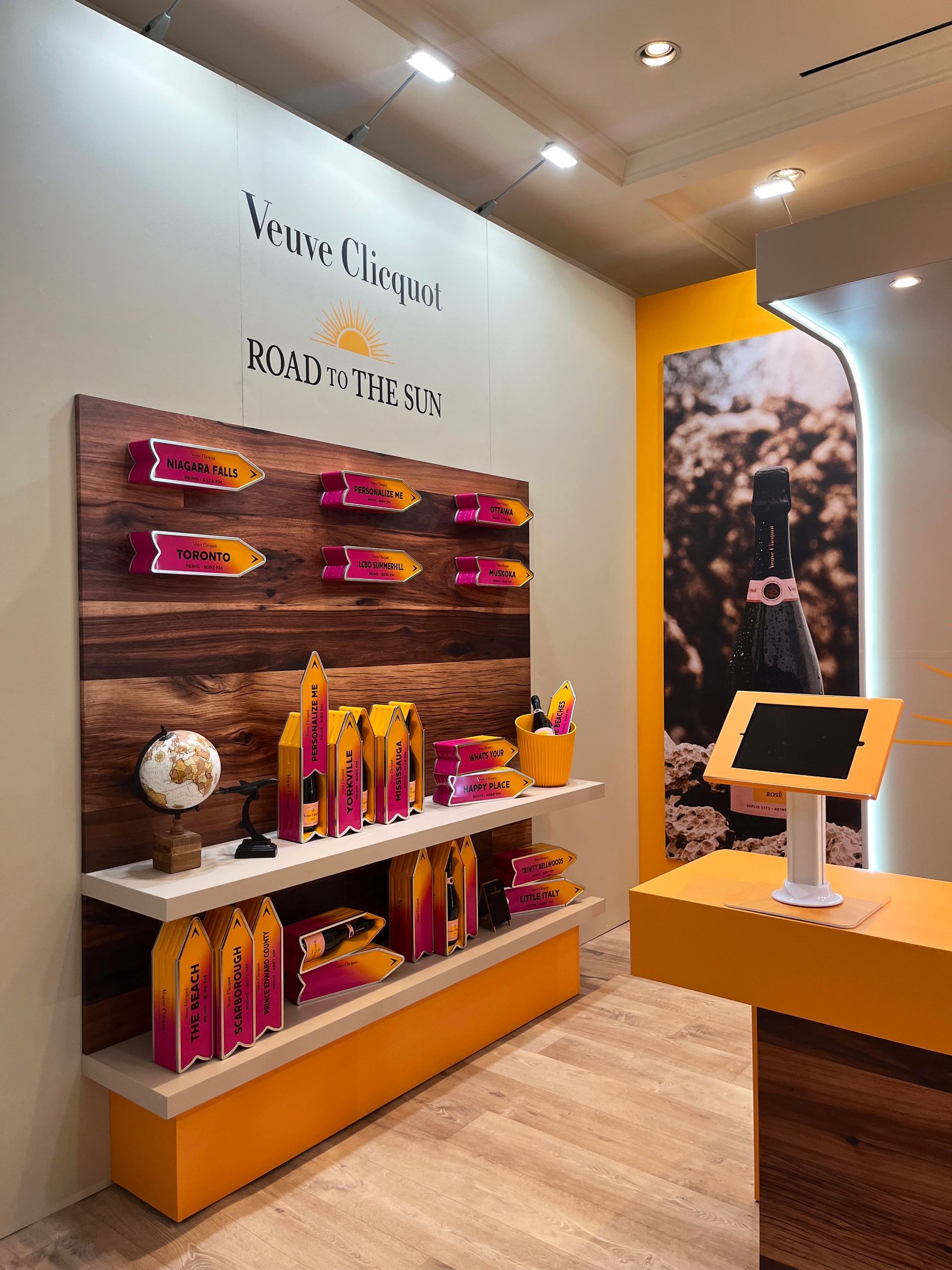 A room with a display of wine bottles on shelves