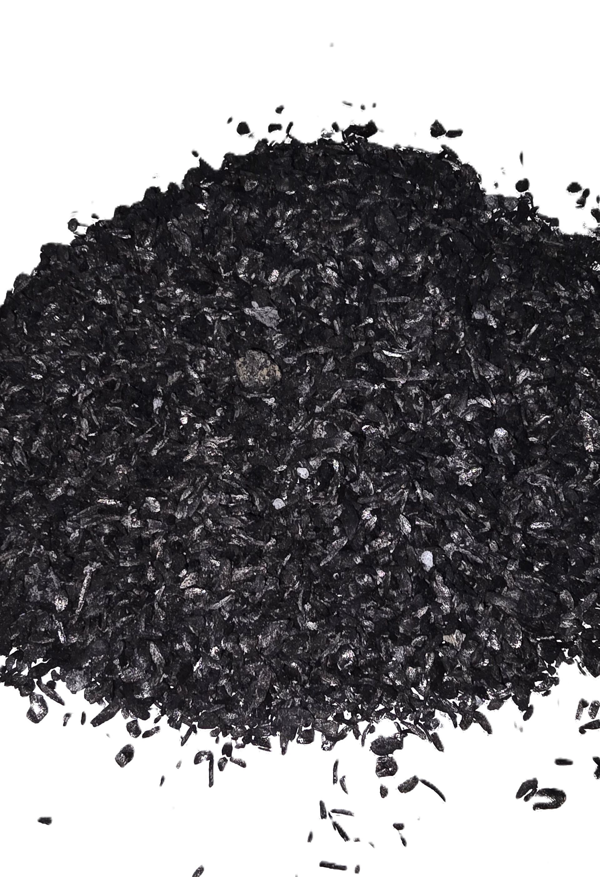 Pile of black granular material on a white background