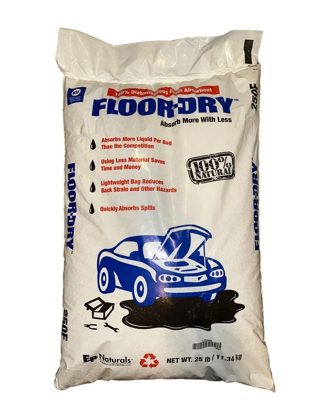 A white 25-pound bag of Floor-Dry absorbent material featuring a graphic of a car over a dark spill.