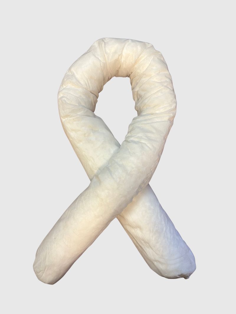 A white, absorbent industrial spill sock shaped into a loop on a light gray background.
