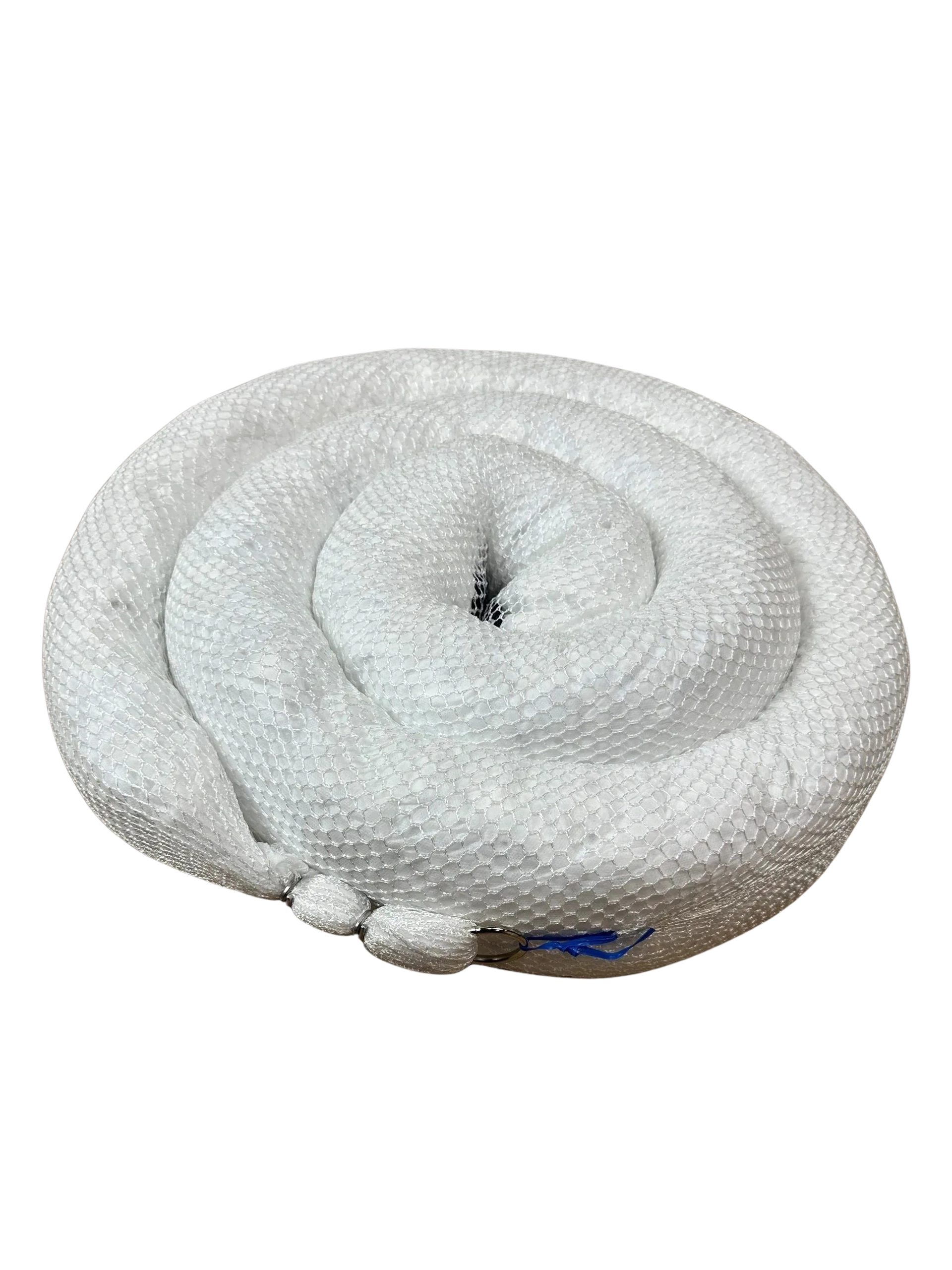 A white, coiled absorbent spill sock, commonly used to contain and soak up industrial fluid leaks.