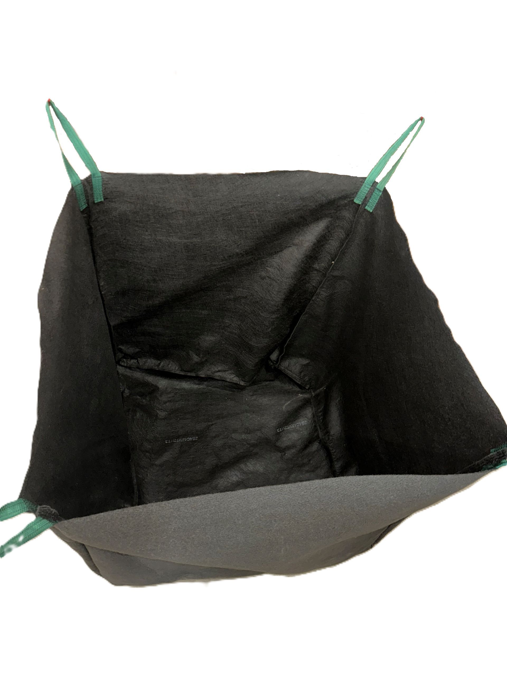 White wire basket holding a folded black fabric bag