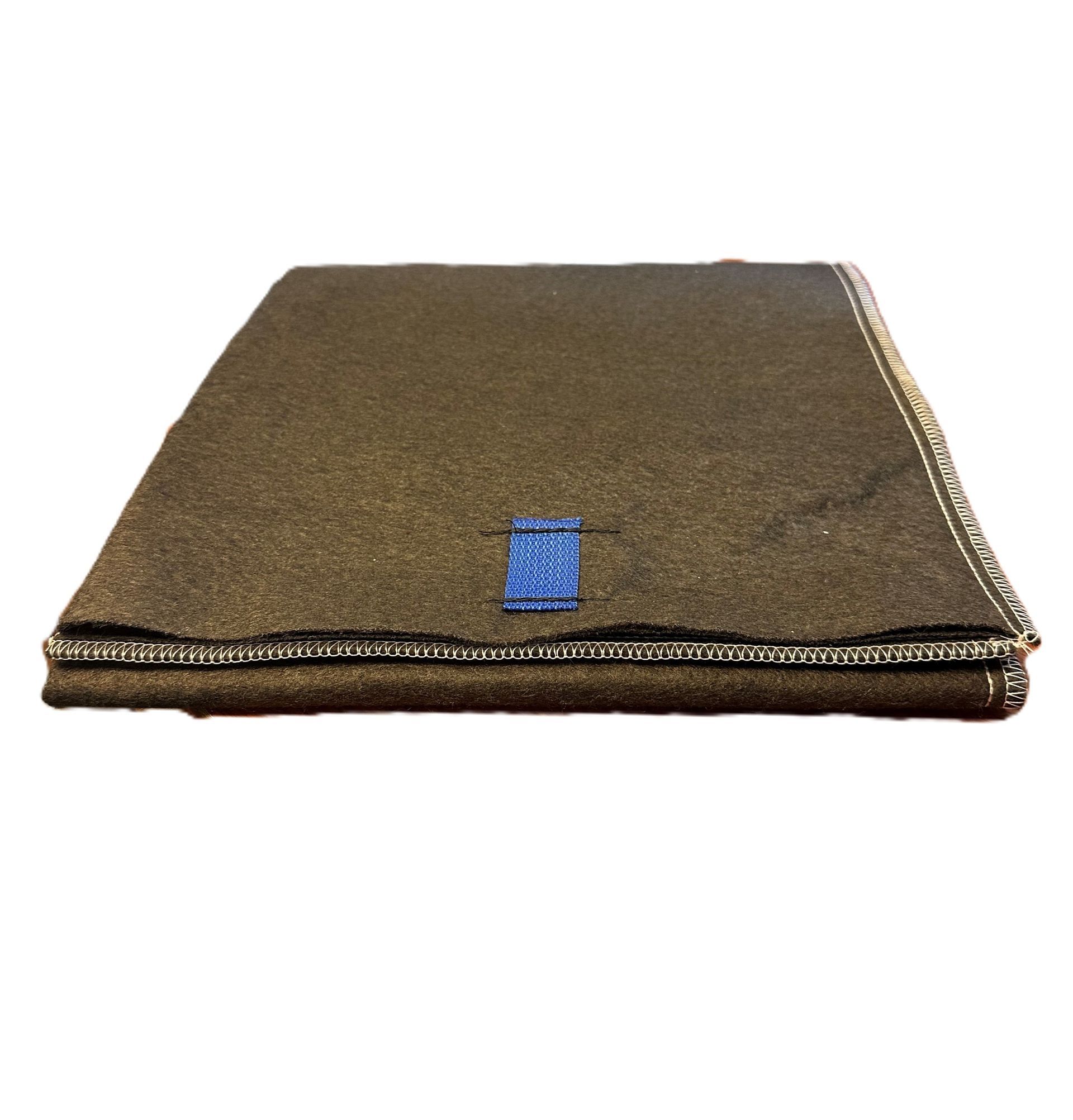 Folded brown textured mat with a small blue label on top