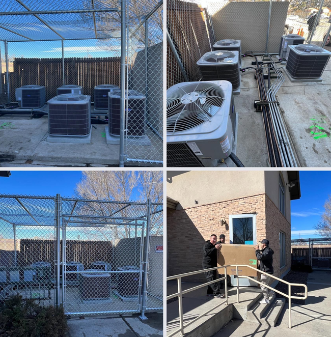 Air-conditioning units and fenced rooftop equipment beside a beige building with stairs and handrails