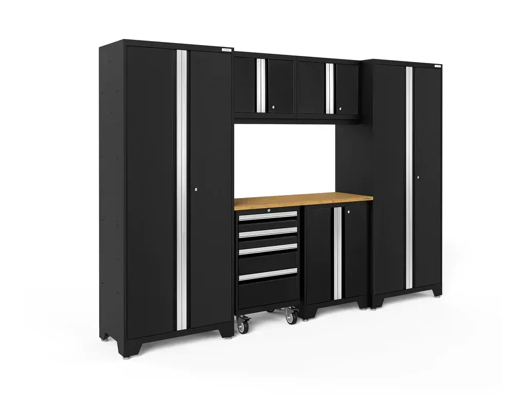 a black garage cabinet set with a wooden table and drawers .
