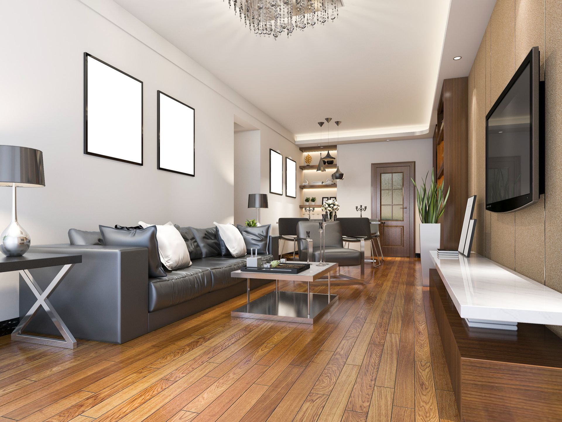 Modern living room with gray sofa, wooden floors, wall-mounted TV, and open shelving in the back.