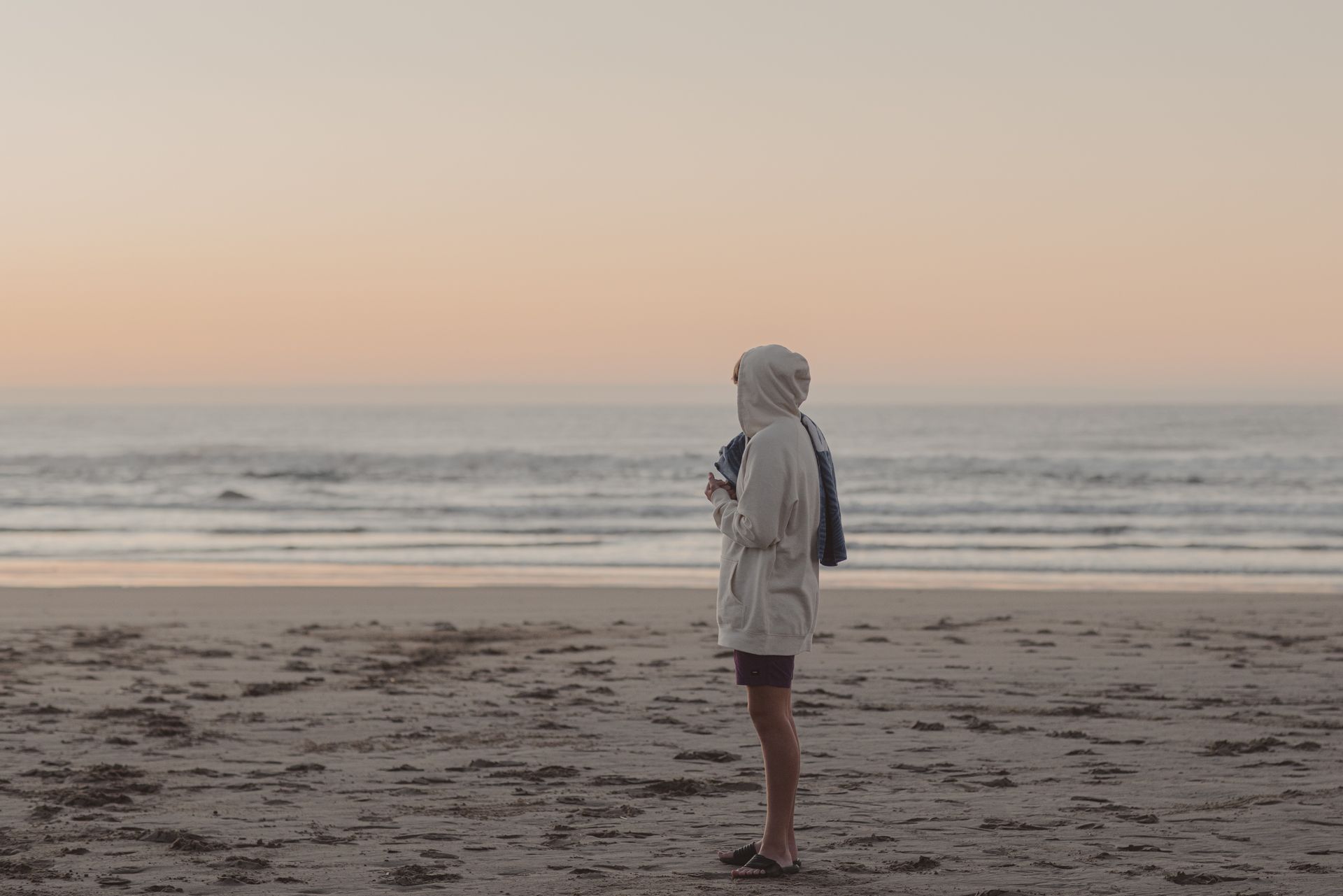 Man standing on Ocean Beach, Hawkes Bay