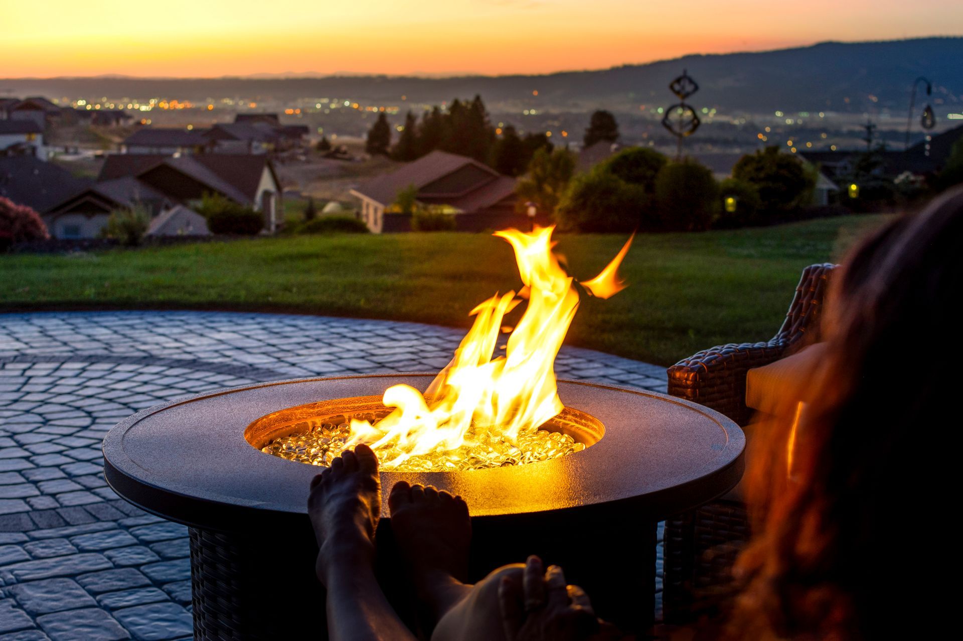 Girl sitting in front of a fireplace