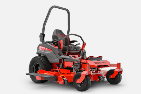 Red and black zero-turn lawn mower on a white background. It has a black roll bar, black seat, and a cutting deck.