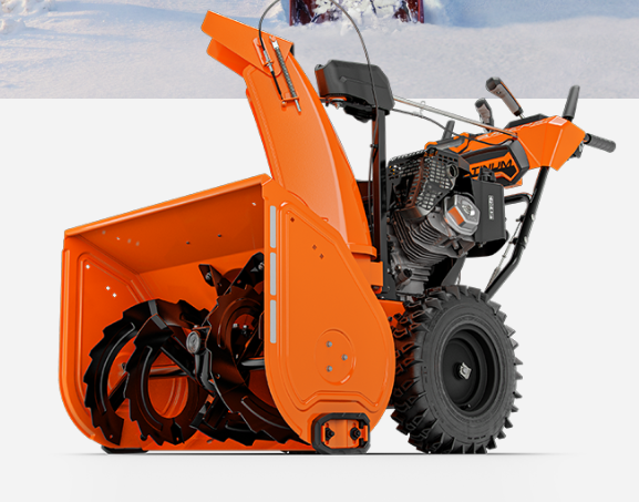 Orange snow blower on a white background, ready for use with its auger visible.
