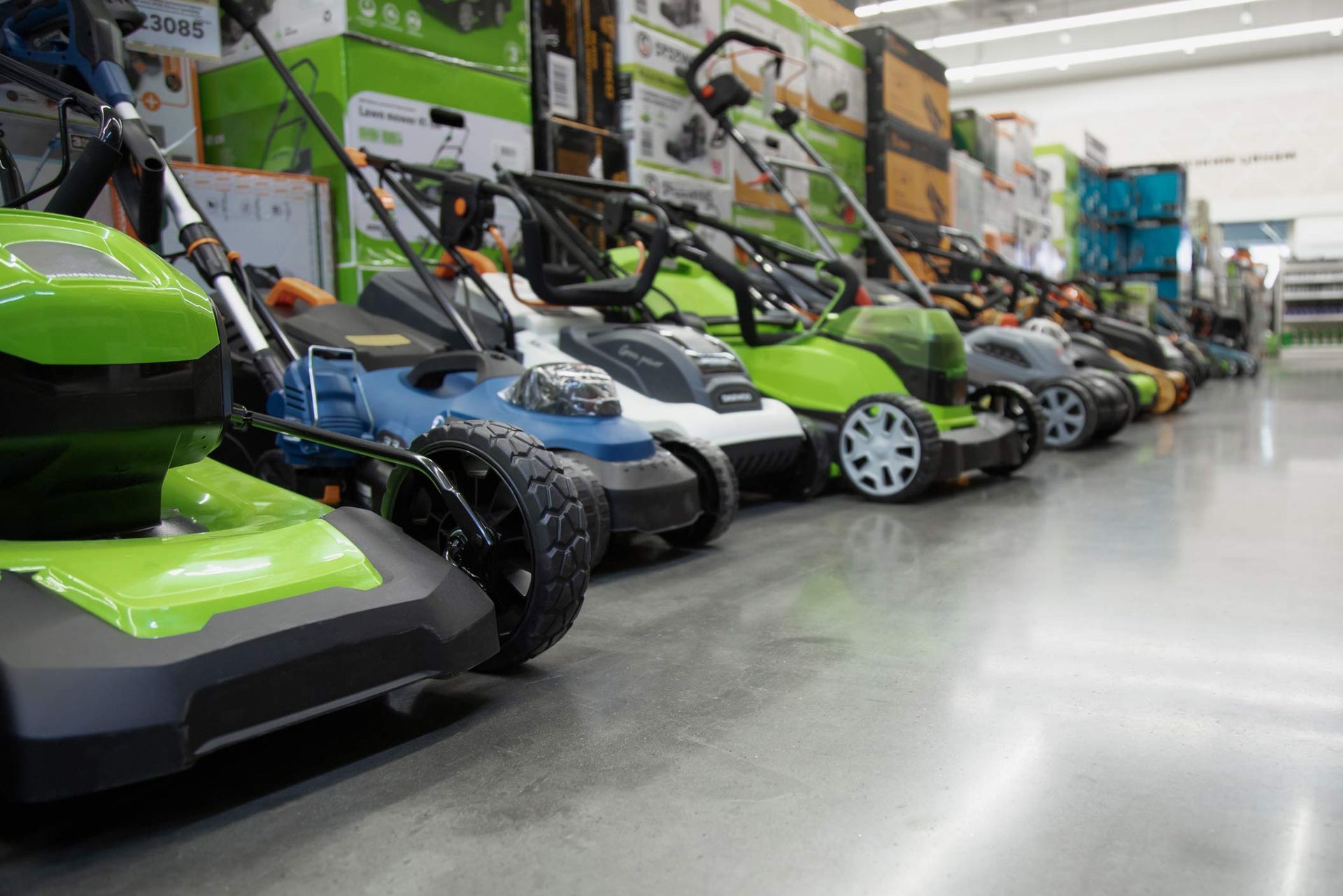 Showcase of new lawn mowers of various colors in a new lawn mower store. Showcase of new lawn mowers of various colors in a new lawn mower store.