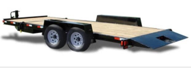 A semi truck is carrying a bulldozer on a trailer.