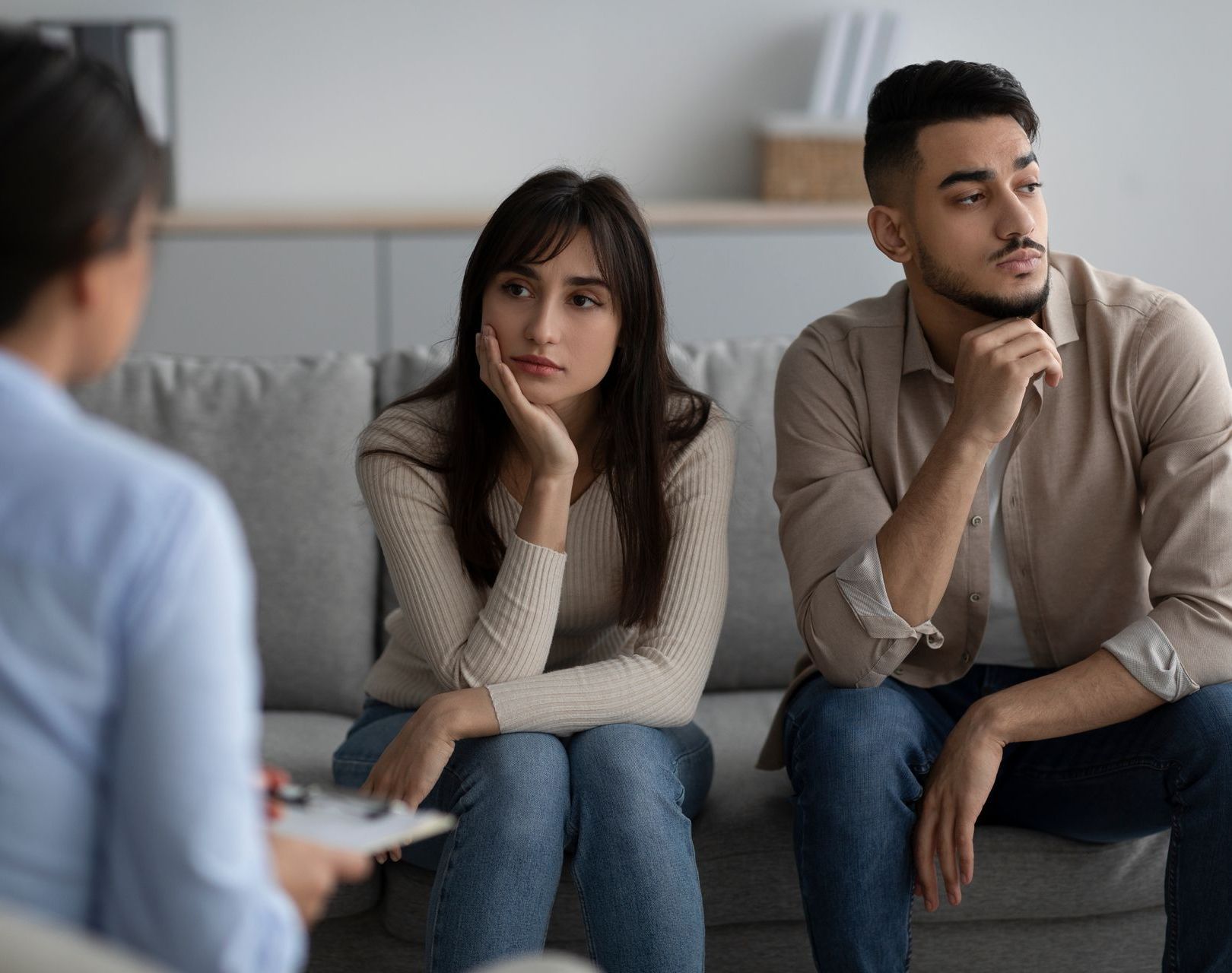 The same couple look away from one another sadly, again wondering Does Marriage Counseling Work