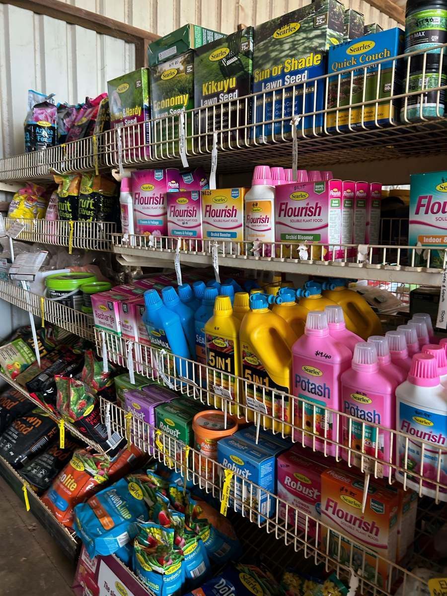 A Shelf Filled With Lots of Garden Supplies in a Store — Barnyard Stockfeed, Pet, Garden and Florist in Childers, QLD