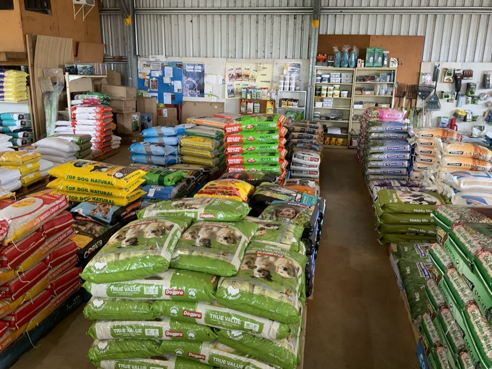 A Warehouse Filled With Lots of Bags of Feeds — Barnyard Stockfeed, Pet, Garden and Florist in Childers, QLD