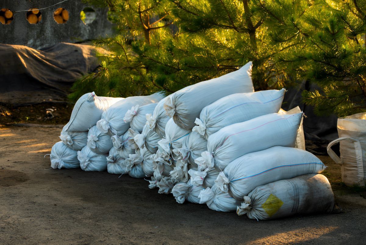 A Pile of Sandbags Are Stacked on Top of Each Other — Barnyard Stockfeed, Pet, Garden and Florist in Childers, QLD