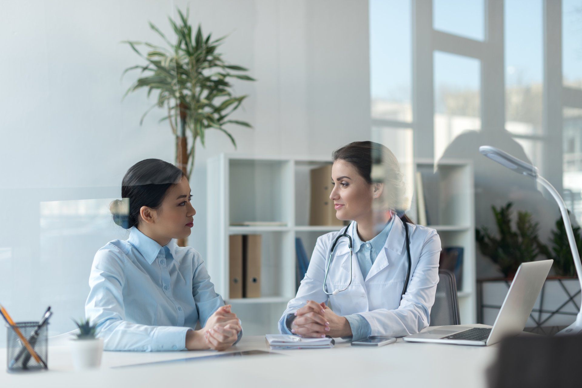 doctor talking with patient during a consult
