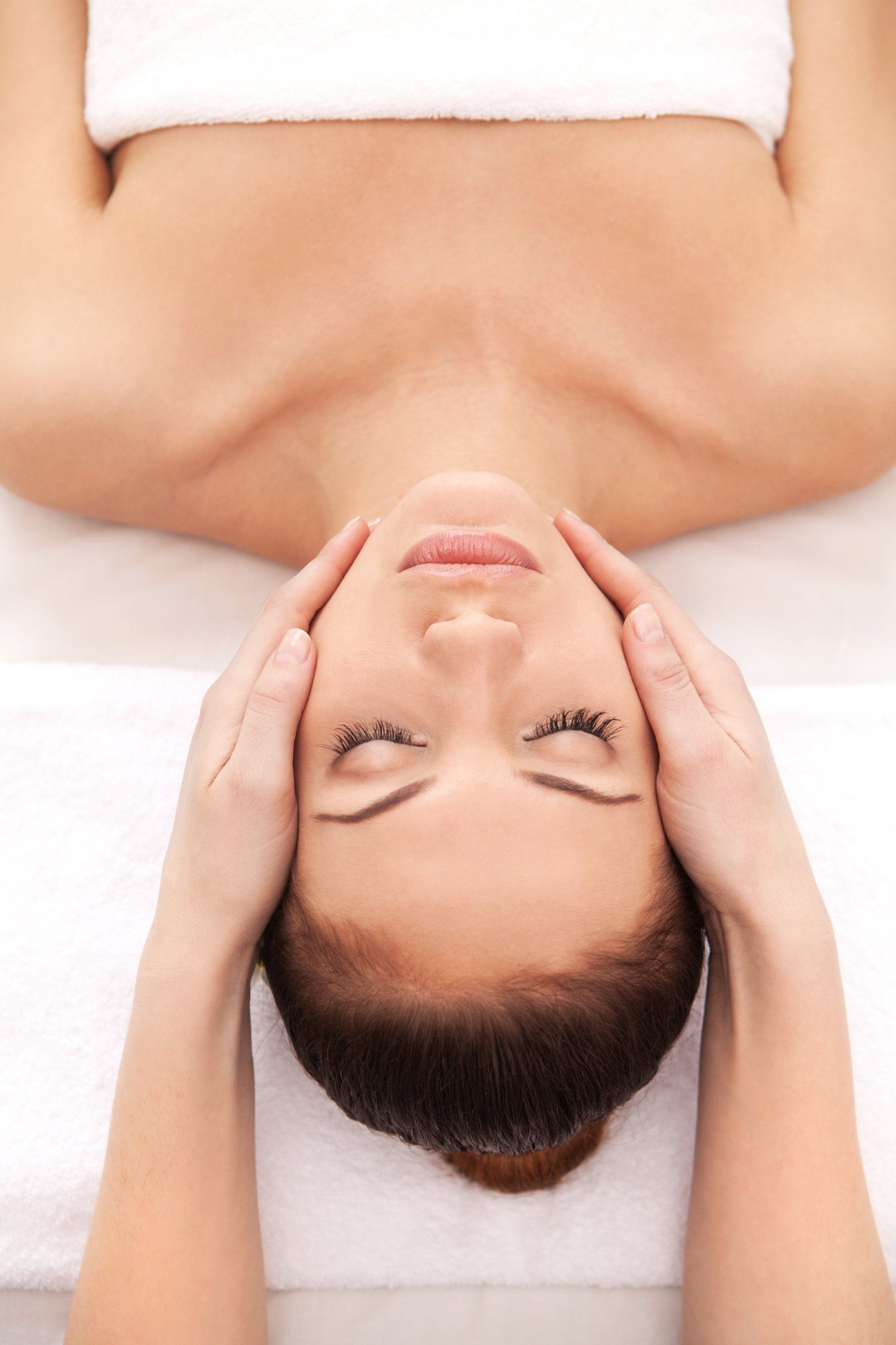 a woman getting facial massage
