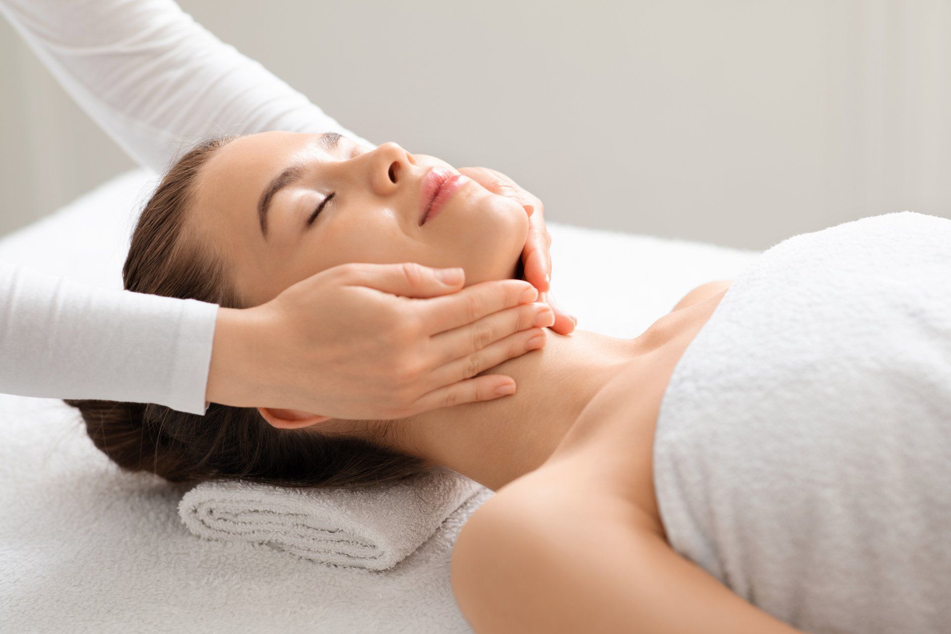 a woman getting a face massage