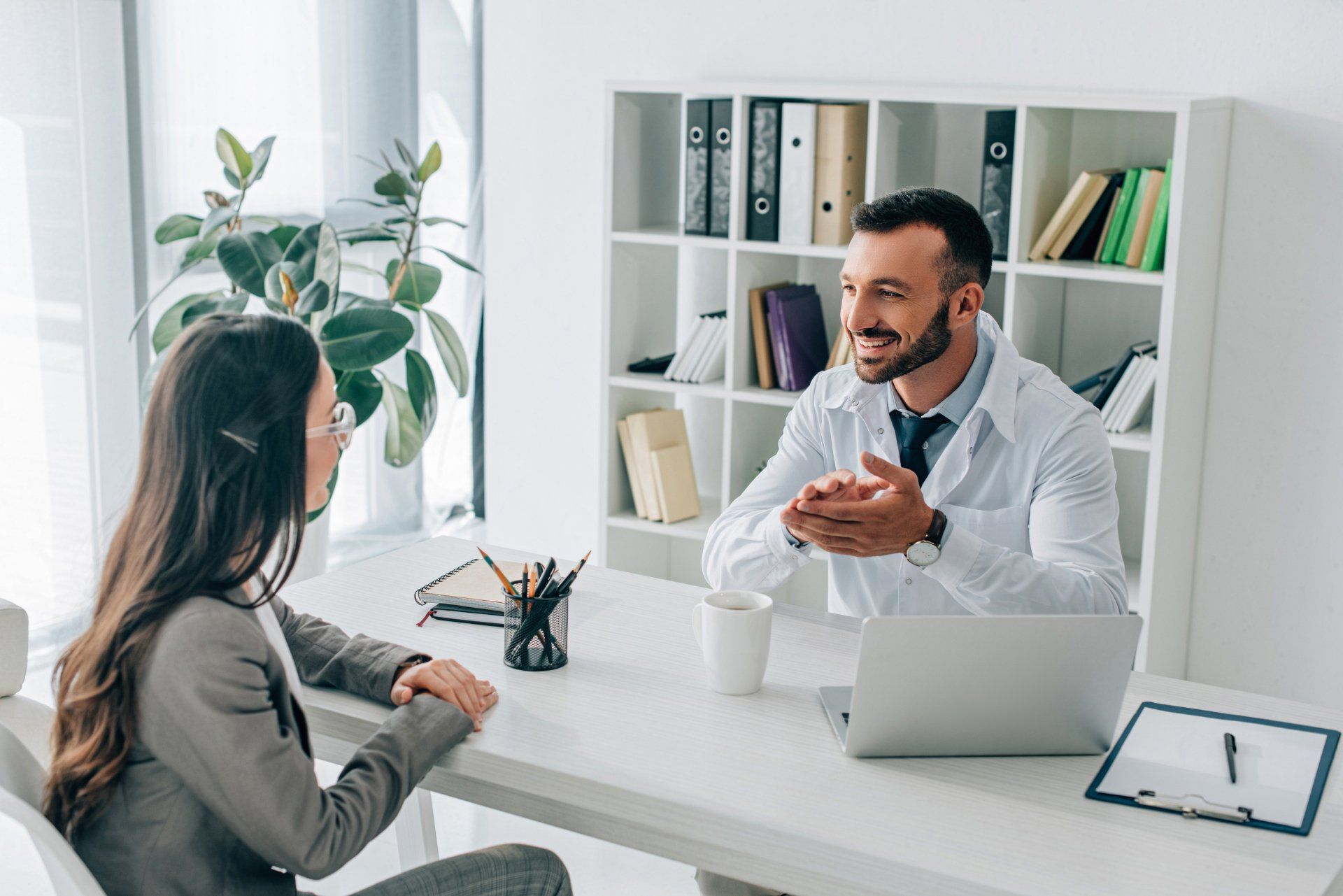 a doctor talking to a patient smiling