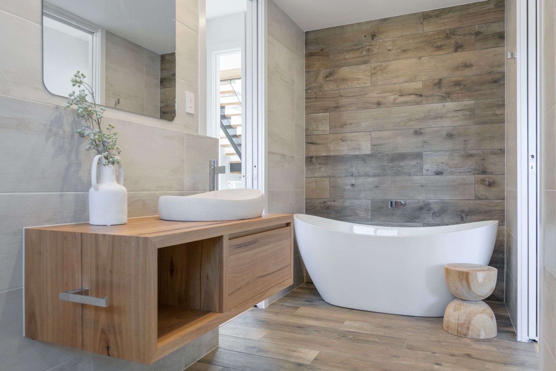 Modern bathroom with a wooden vanity and freestanding tub — Indie Living In Lake Macquarie, NSW