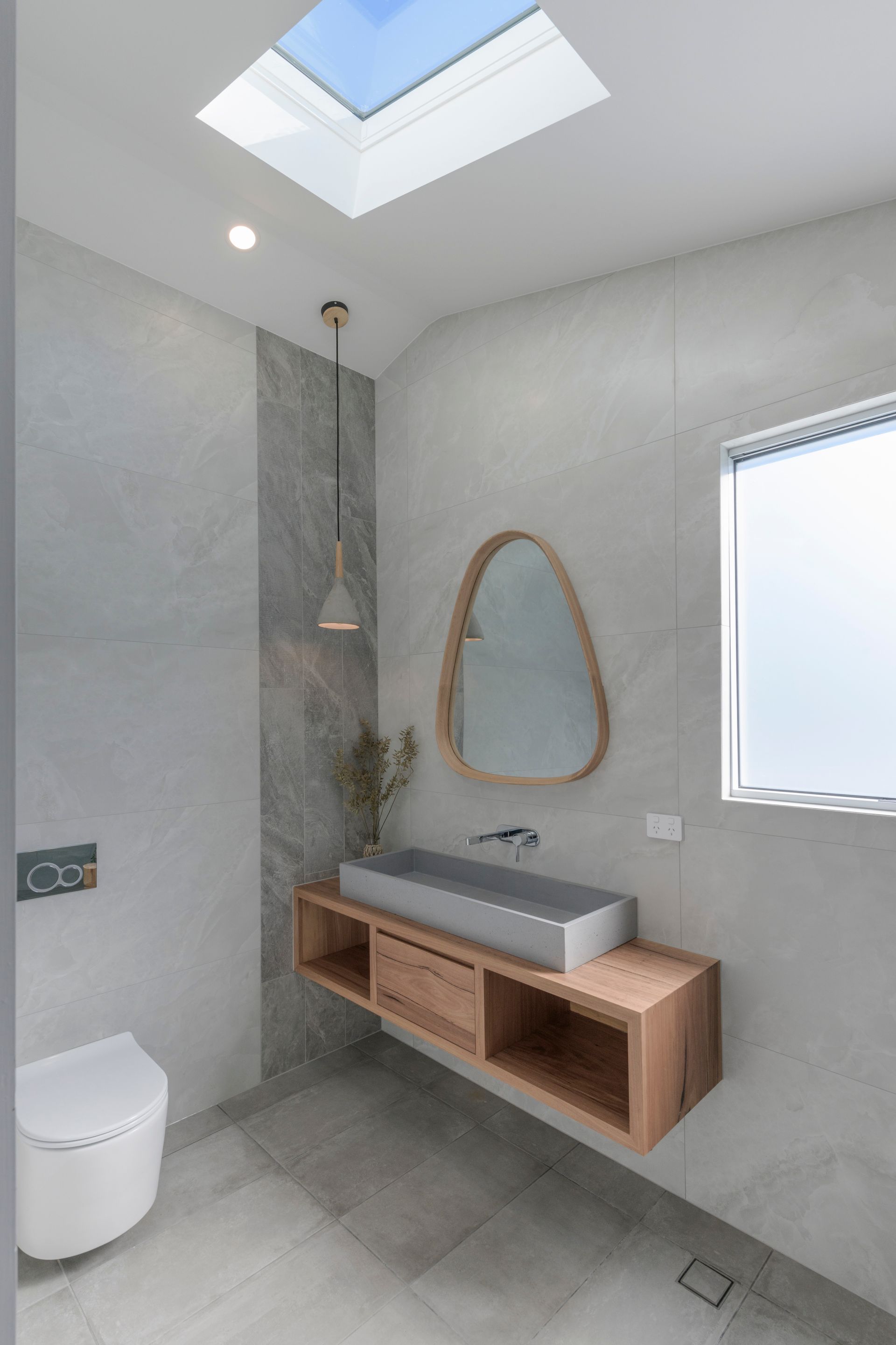 Modern Bathroom With Floating Wooden Vanity, Concrete Sink and Gray Tile Walls — Indie Living In Lake Macquarie, NSW