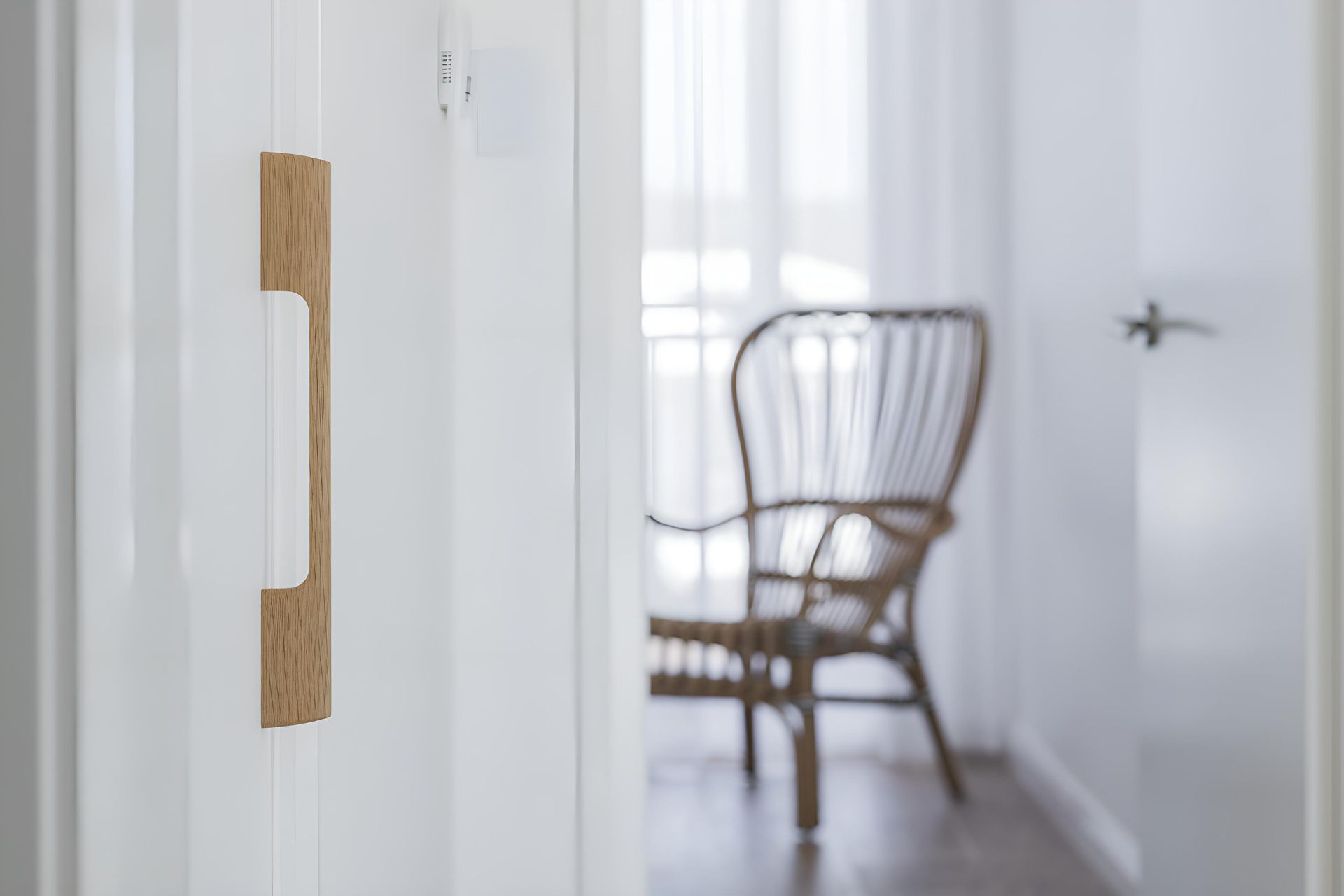 A Chair is Sitting in a Hallway Next to a Door — Indie Living In Bennetts Green, NSW