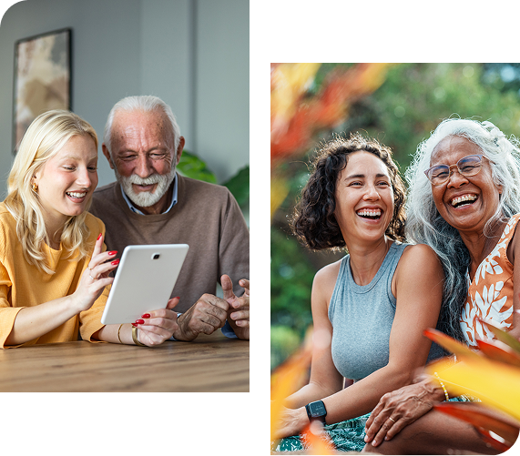 Two groups of people looking at a tablet and laughing outdoors.