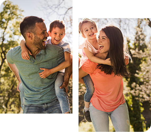 Father and son, and mother and daughter, enjoy piggyback rides outdoors; smiling.