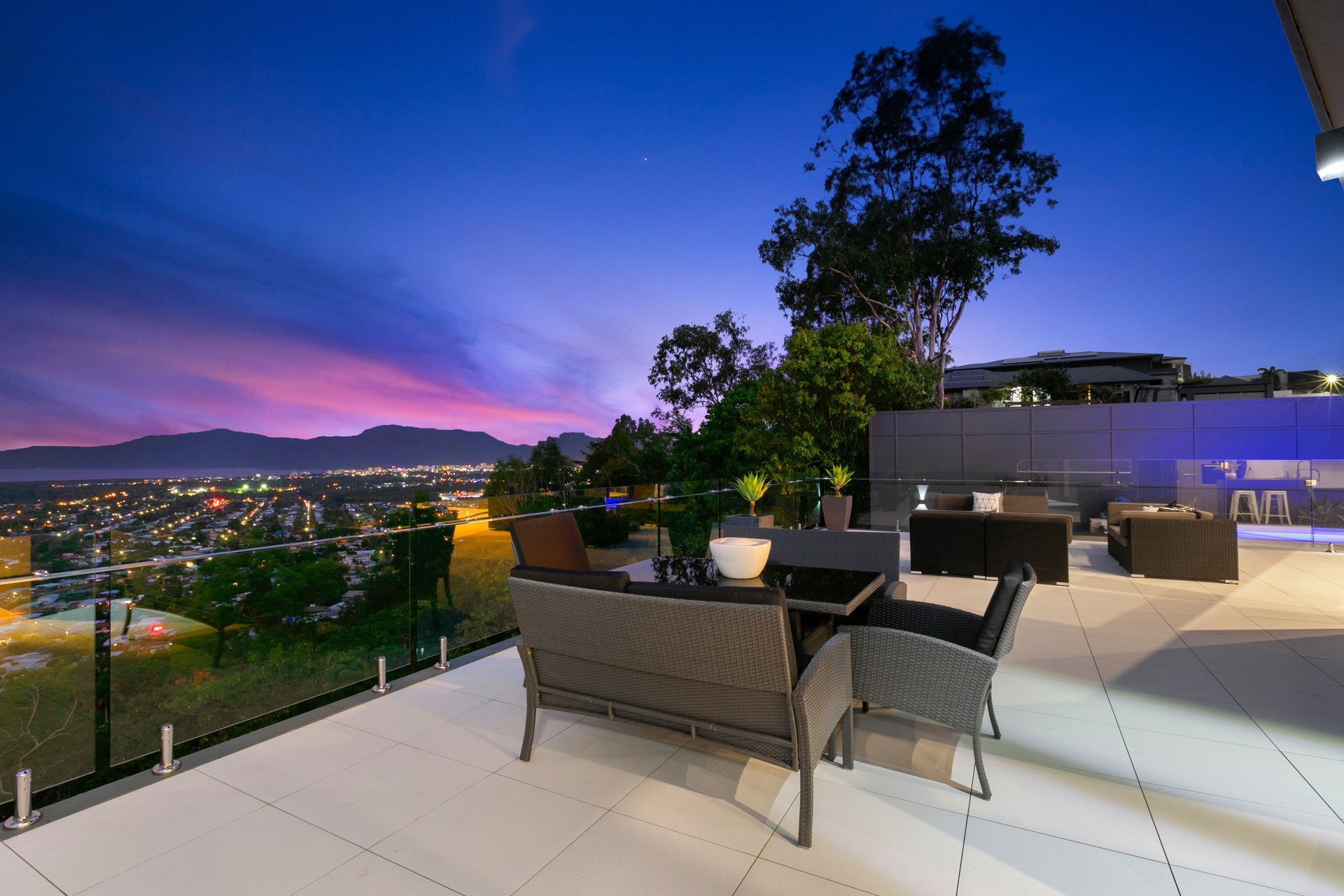 A Patio With A View Of A City At Night  — Omni Builders In Innisfail, QLD