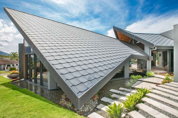 A Modern House With a Roof That Looks Like a Butterfly — Omni Builders In Bungalow, QLD