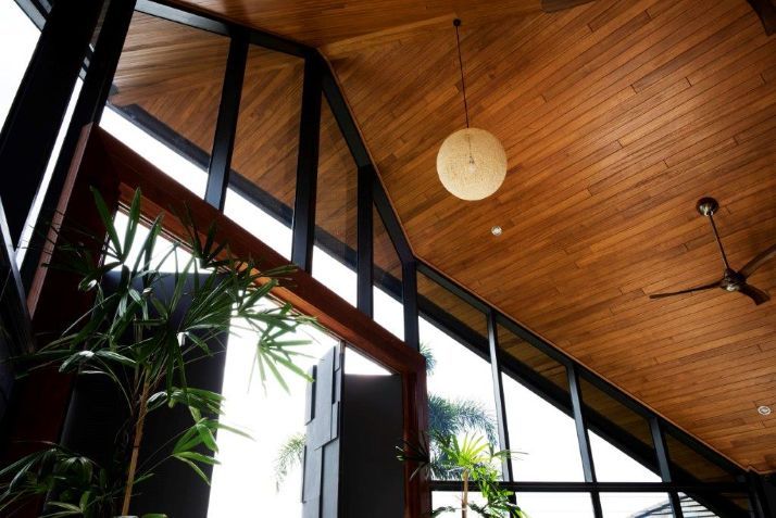 A Room With a Wooden Ceiling and a Ceiling Fan — Omni Builders In Bungalow, QLD