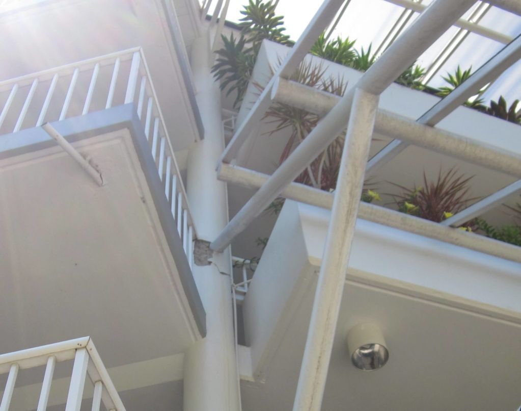 A Building With Stairs Leading Up to a Balcony — Omni Builders In Bungalow, QLD