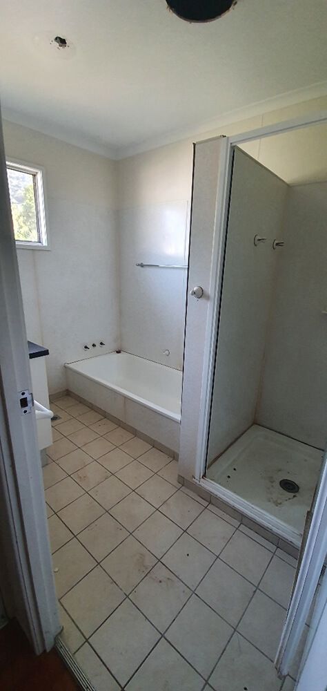 A Bathroom With a Bathtub and a Shower — Omni Builders In Bungalow, QLD