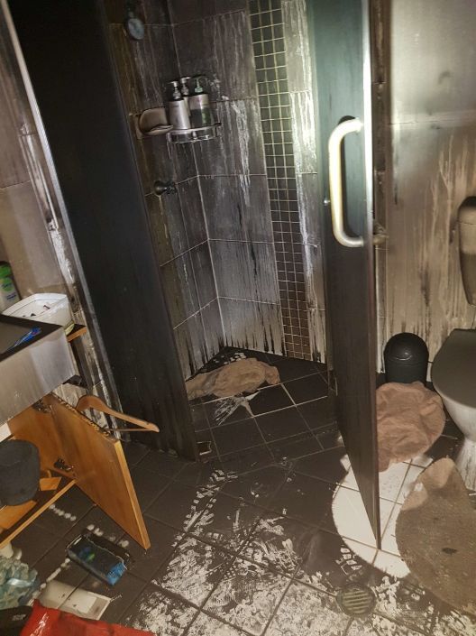 A Bathroom With a Shower , Toilet , and Sink — Omni Builders In Bungalow, QLD