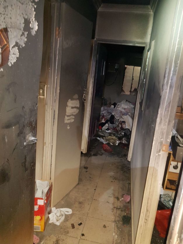 A Hallway With a Door and a Lot of Trash on the Floor — Omni Builders In Bungalow, QLD