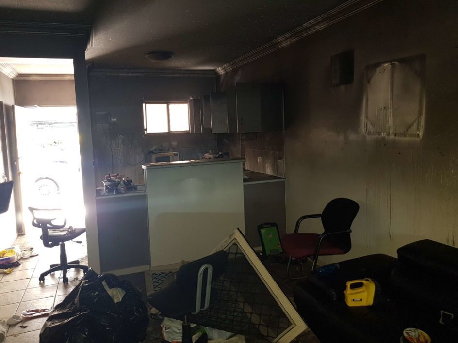 A Room With a Lot of Trash in It and a Kitchen in the Background — Omni Builders In Bungalow, QLD