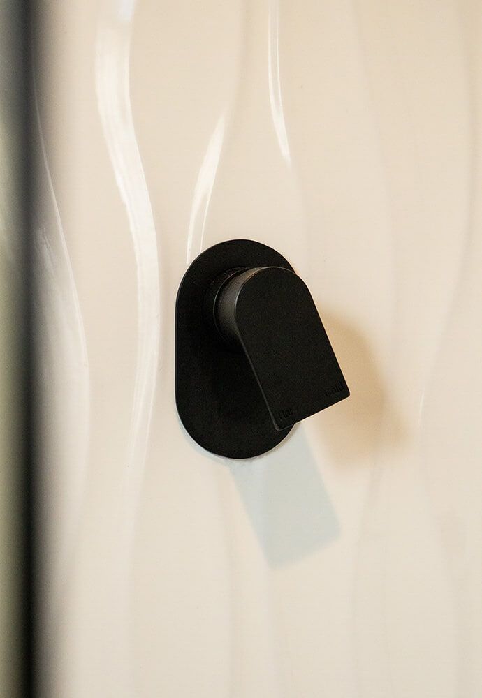 A Close Up of a Black Knob on a White Wall — Omni Builders In Bungalow, QLD