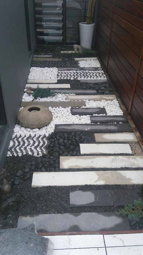 A walkway with a lot of rocks and stones on it — Omni Builders In Bungalow, QLD