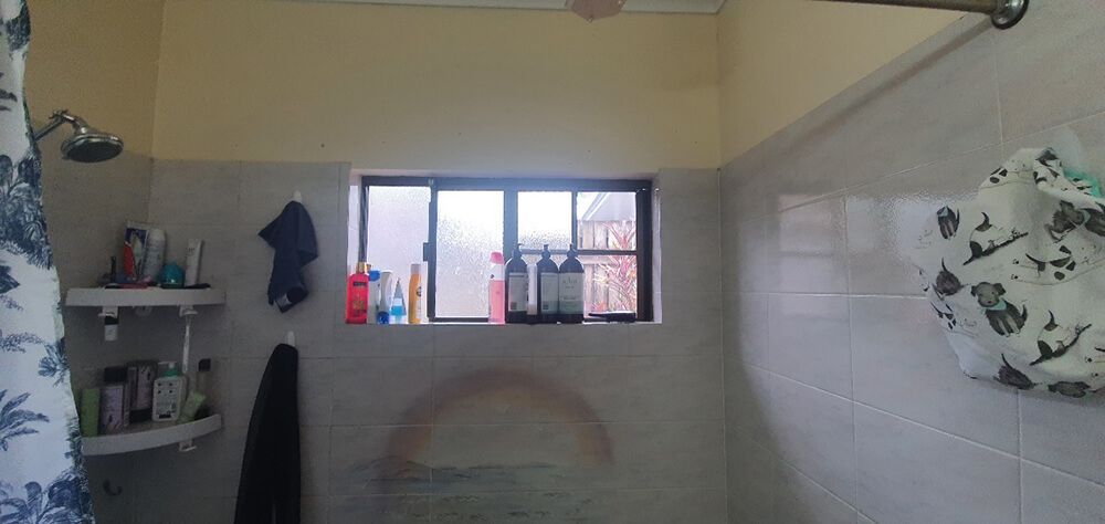 A Bathroom With a Shower and a Window — Omni Builders In Bungalow, QLD