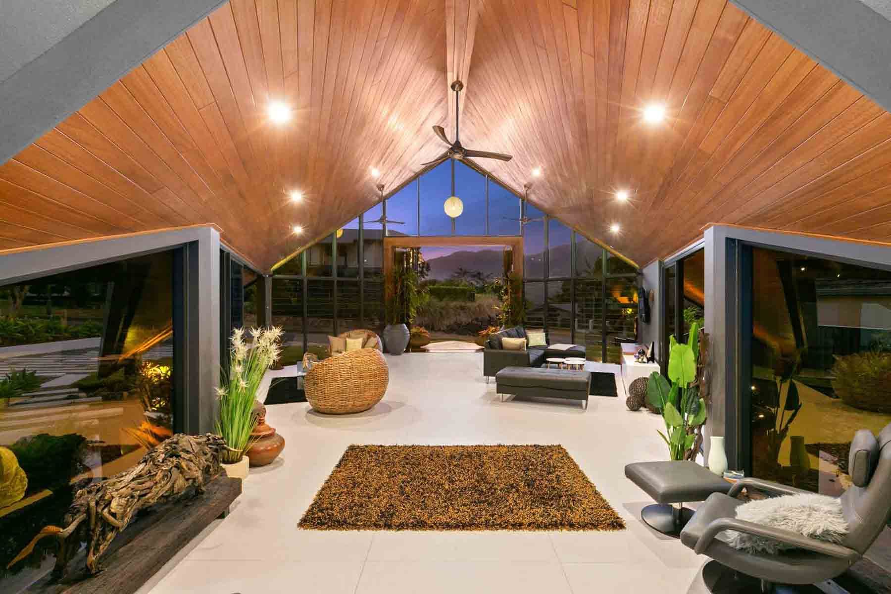 A Living Room With A Vaulted Ceiling And A Lot Of Windows — Omni Builders In Bungalow, QLD