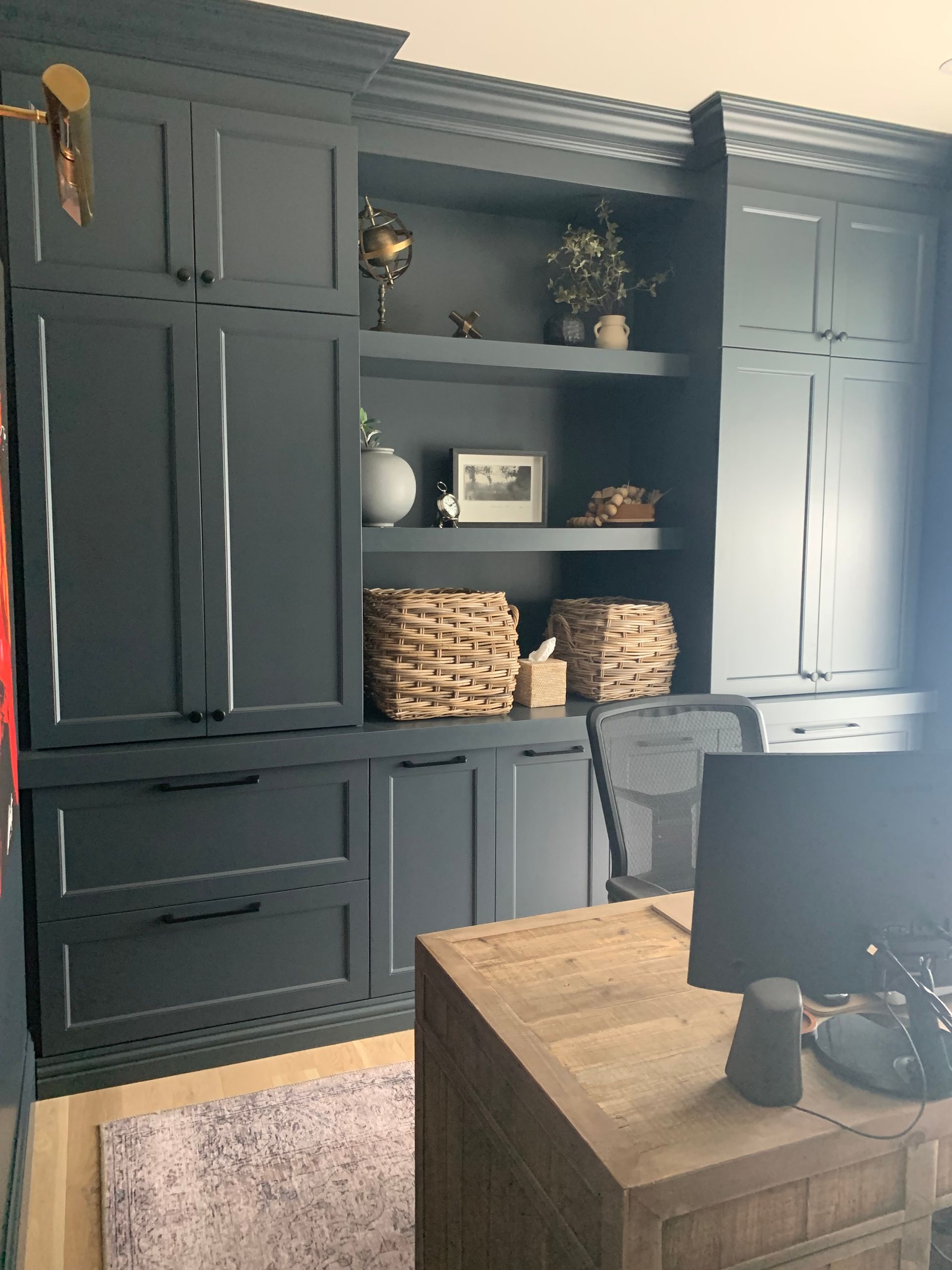 A room with a desk and a computer on it