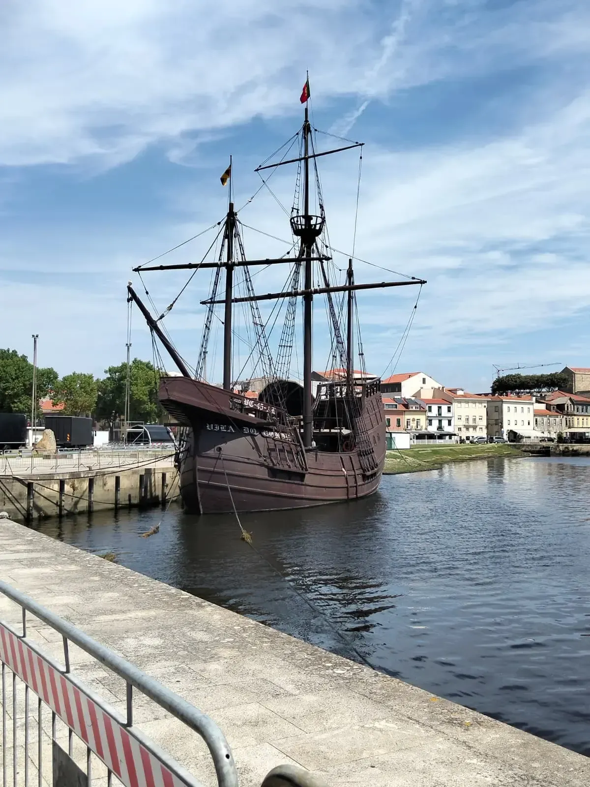 Replica of a historic Portuguese caravel moored on the river