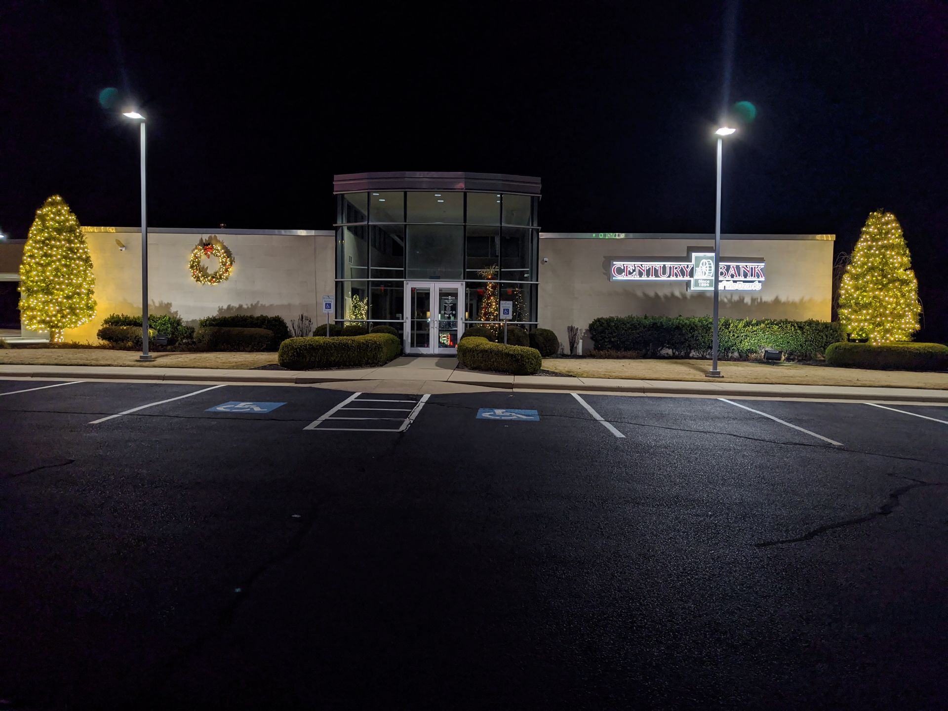 A large building with a lot of lights on it is lit up at night.