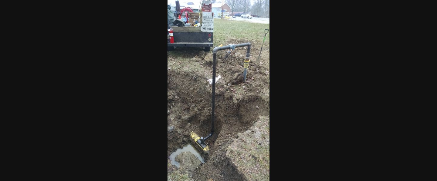A person is digging a hole in the ground with a shovel.