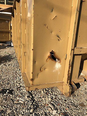 dumpster repair due to rusted hole that needs pataching