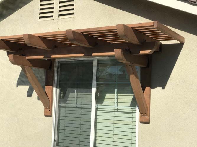 A window with a wooden awning over it