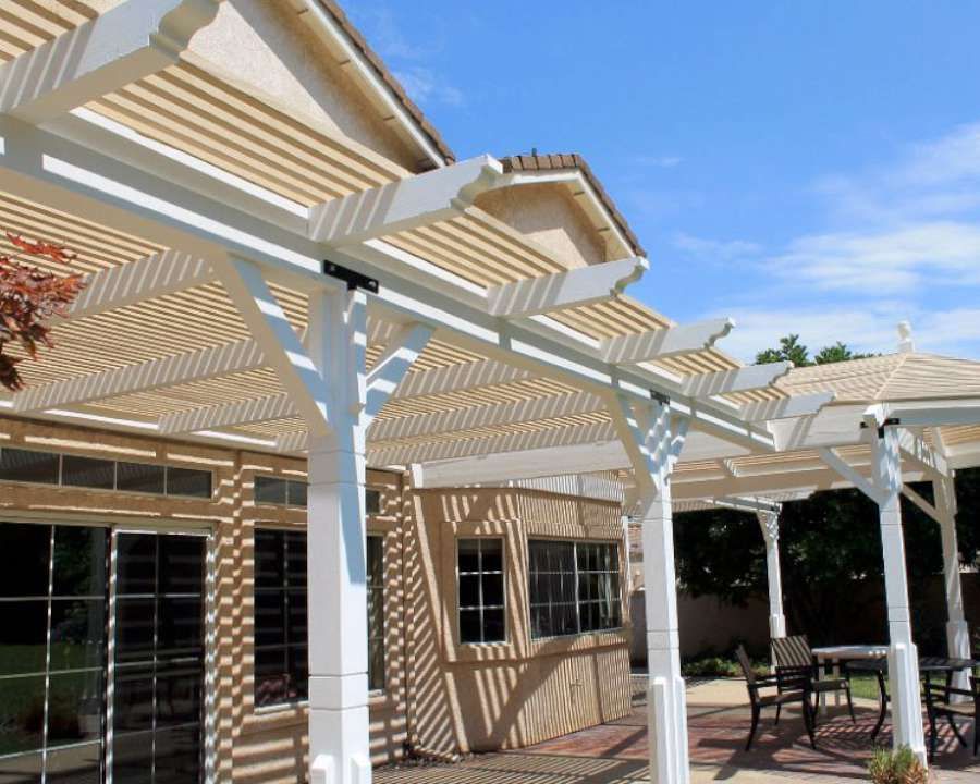 A house with a pergola on top of it